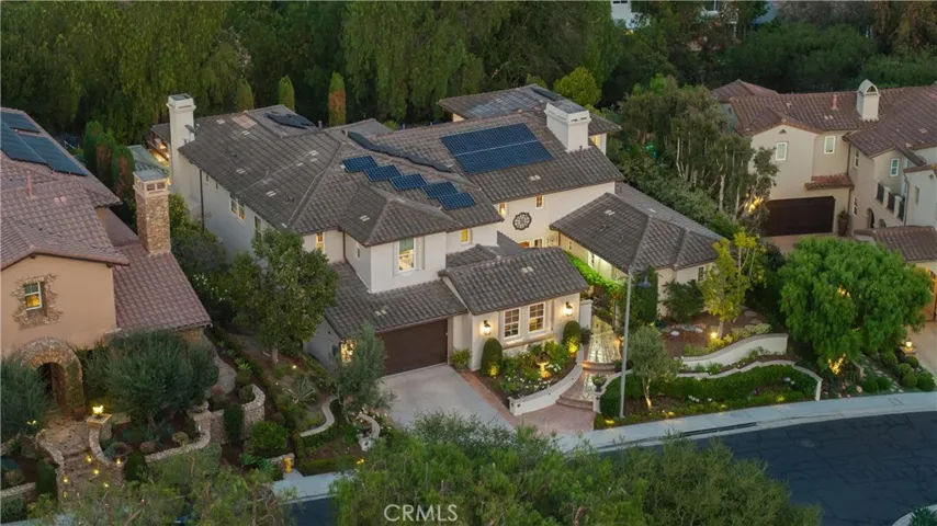 Aerial perspective highlighting the owned solar system, impressive footprint, and thoughtfully designed outdoor living spaces.