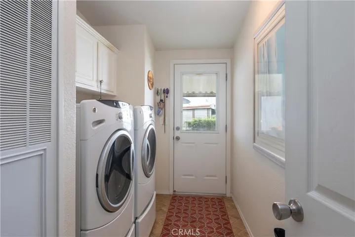 Laundry room with side access door