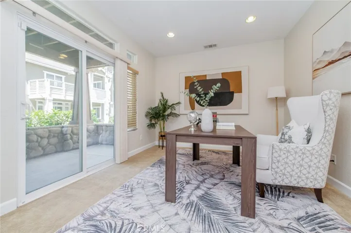 Main-floor office/flex room with direct access to the front porch