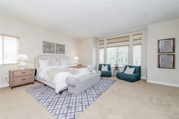 Spacious primary suite is bright and airy