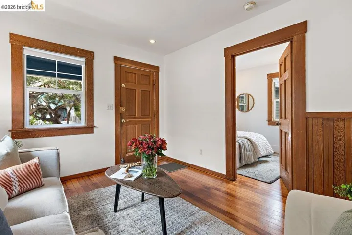 Warm wood-finish flooring complemented by white walls