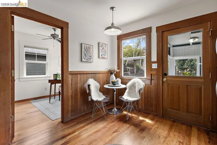 Hardwood flooring throughout, complemented by wood paneling and trim