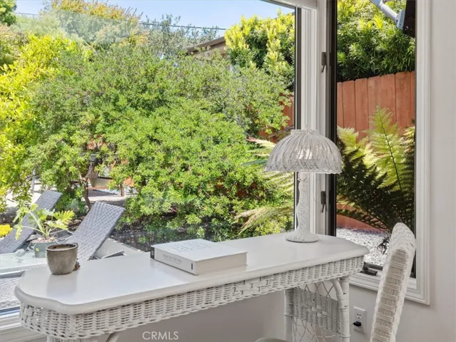 This gorgeous desk area looks out over the backyard, once could also put a lounge chair here.