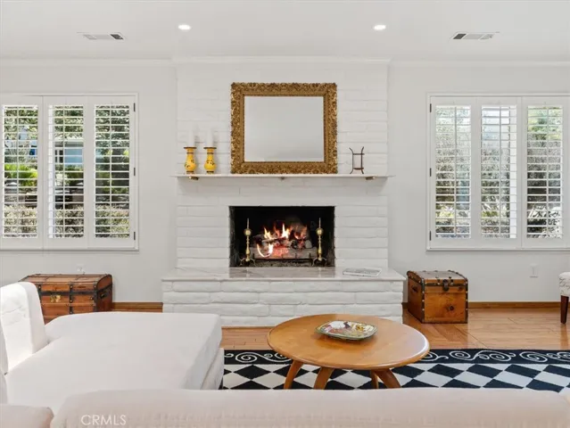 The gas log fireplace creates the coziest atmosphere in the living room.