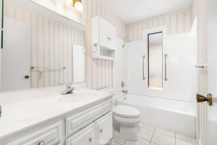 Primary bathroom with tub shower combination