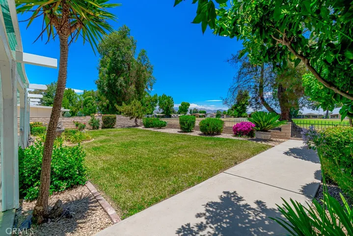 Well cared for backyard with views of golf course