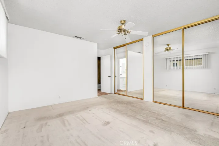 Spacious primary bedroom with lots of closet space