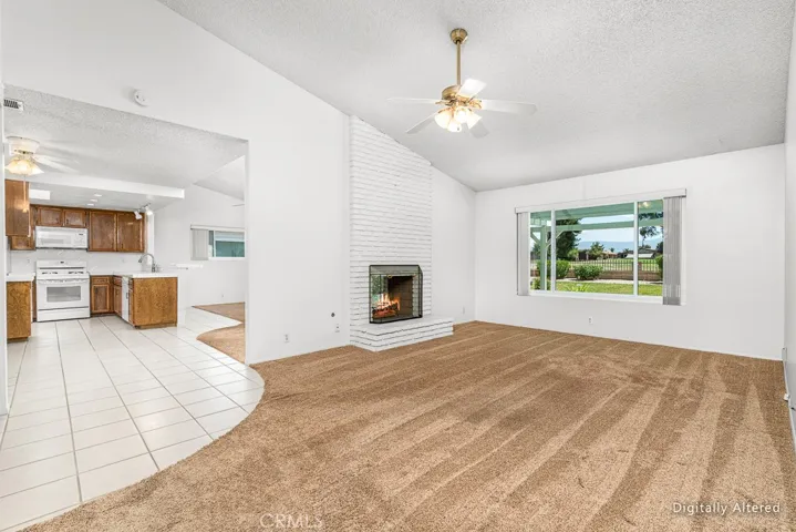 Fireplace and natural lighting that faces golf course