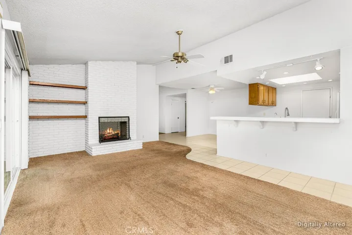 Fireplace in living room with breakfast bar