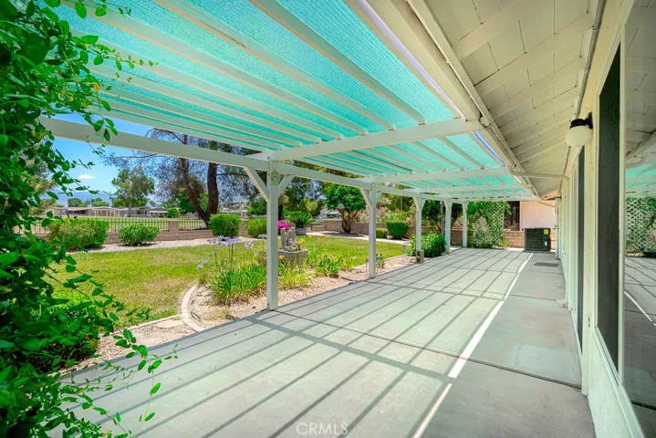 Step outside to a fully covered patio facing beautiful well maintained yard
