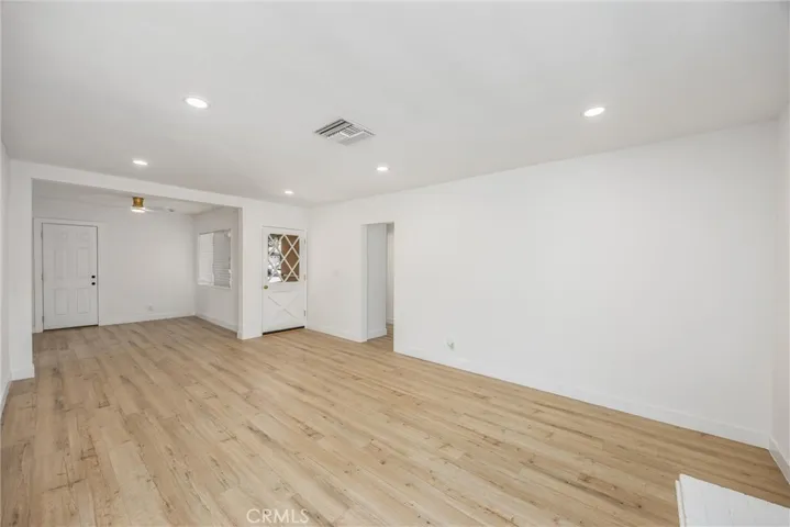 All new textured and painterd walls and ceilings with newly added recessed lighting and beautiful laminate floors throughout the entire home!
