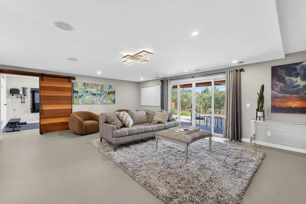 Family room leads to outdoor patio and pool area