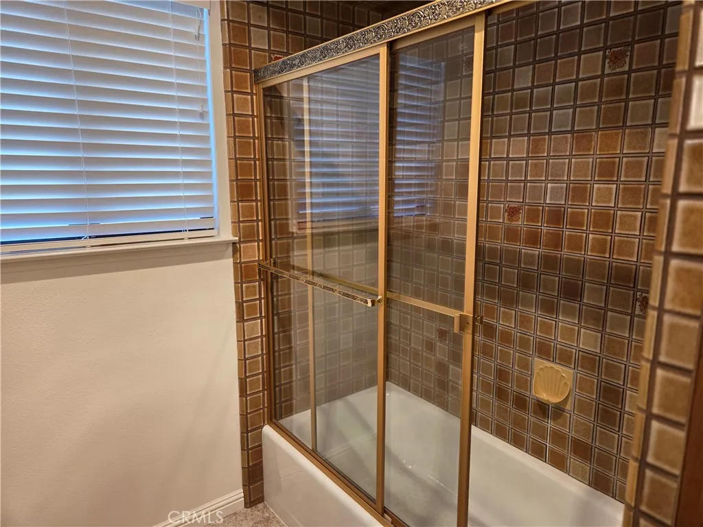 Full bathroom with shower and tub