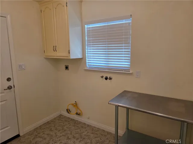 Washroom off of kitchen with access to garage