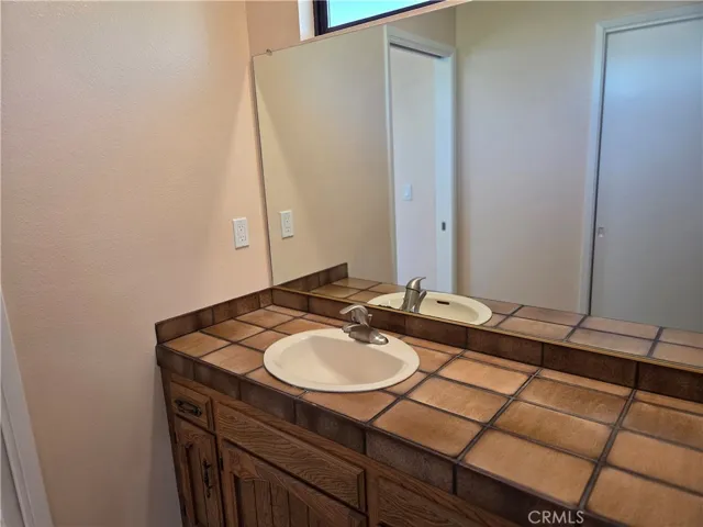 Separate sink near walk in closet