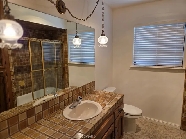 Full bathroom near front two bedrooms