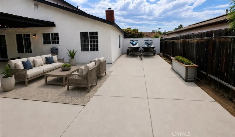 Digitally Altered - Jetskiis and Patio furniture added to image.  Modifications to fence and frontyard block wall required to accomodate trailer parking
