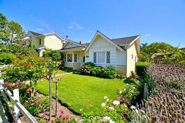 Enjoy an enchanting escape in the private yard with beautiful landscaping leading to entrance of home.
