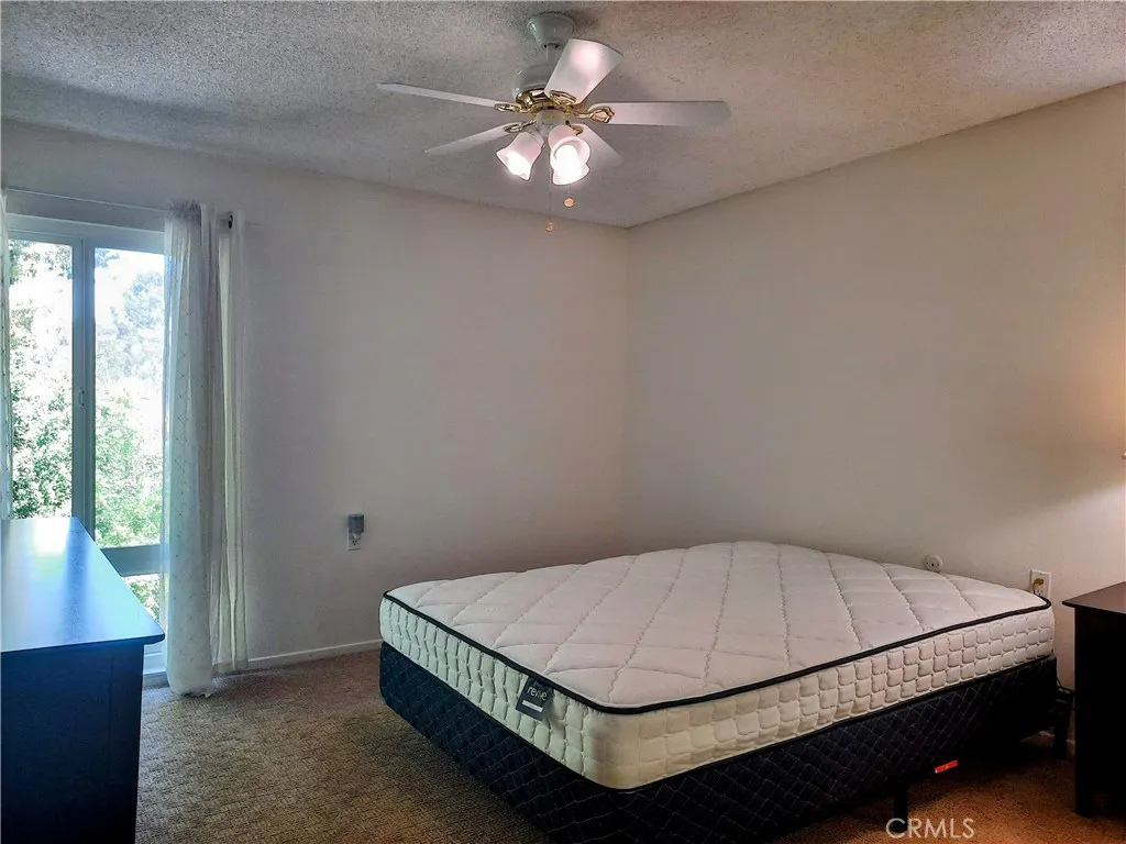Primary bedroom w/ ceiling fan Primary bedroom w/ ceiling fan