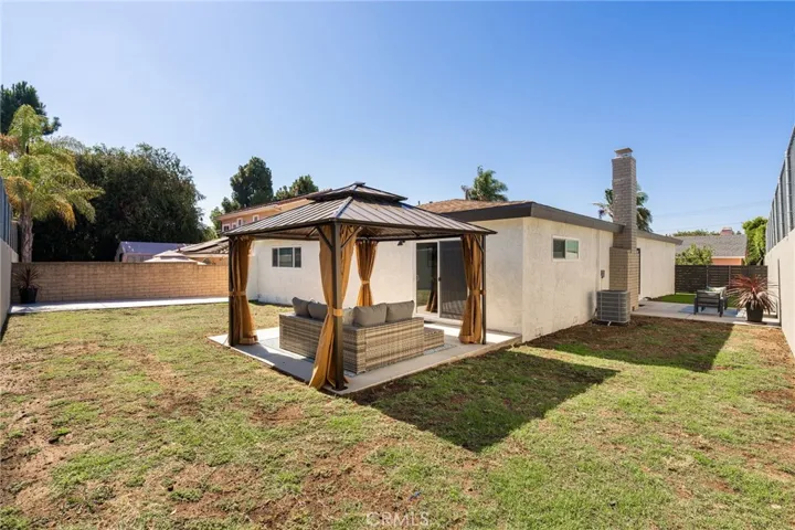 Spacious back yard with covered patio