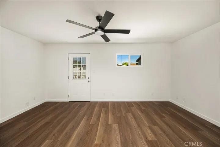 MASTER BEDROOM WITH DOOR LEADING TO THE BACKYARD