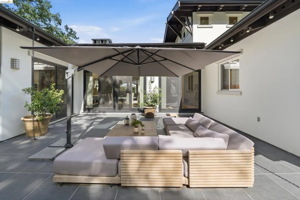 Expansive patio with large format pavers and a neutral color palette