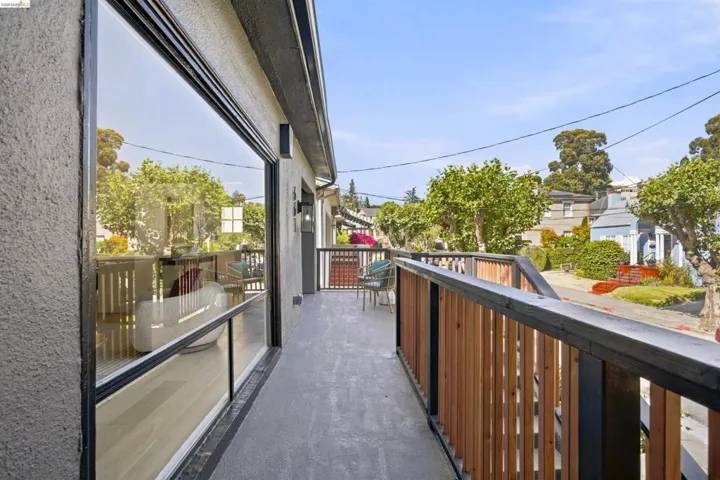 Exterior balcony with contemporary wood and black metal railing