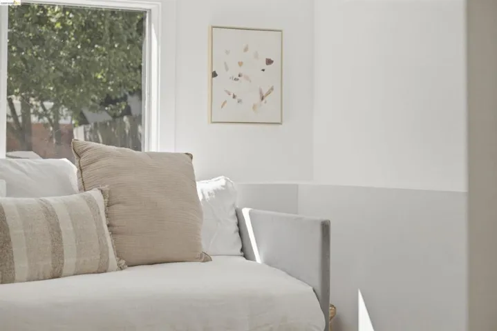 Bright interior with white walls and a large window