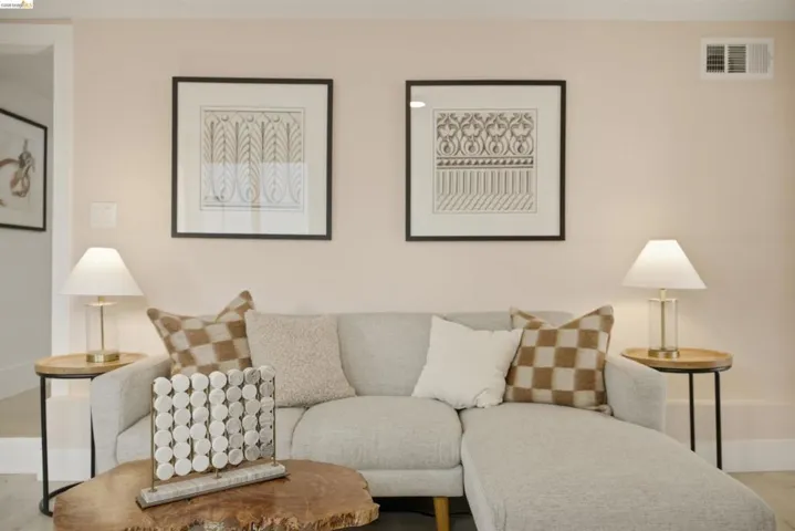 Light-toned walls complement the white baseboards and neutral flooring