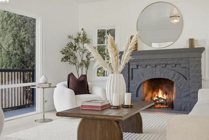 Stone-surround fireplace with an arched opening and a substantial mantelpiece