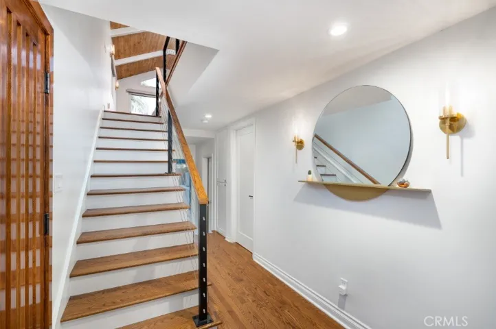 Entry with Custom Stairwell, Door, Railings & More!