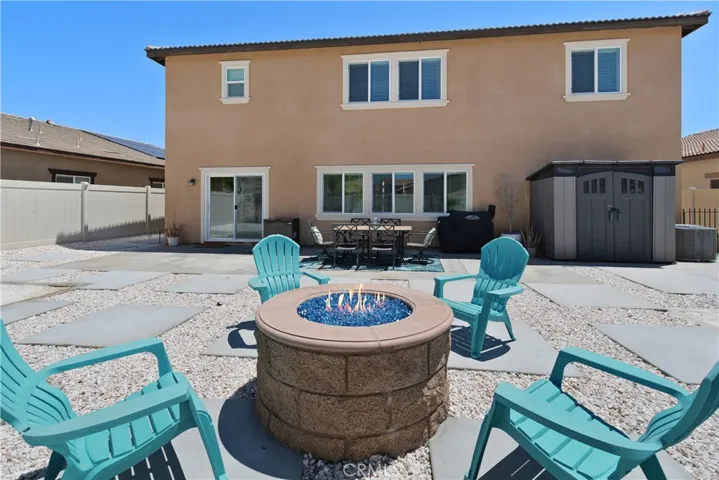 Oversized backyard featuring a firepit—perfect for outdoor entertaining, relaxing evenings, and gathering under the stars.