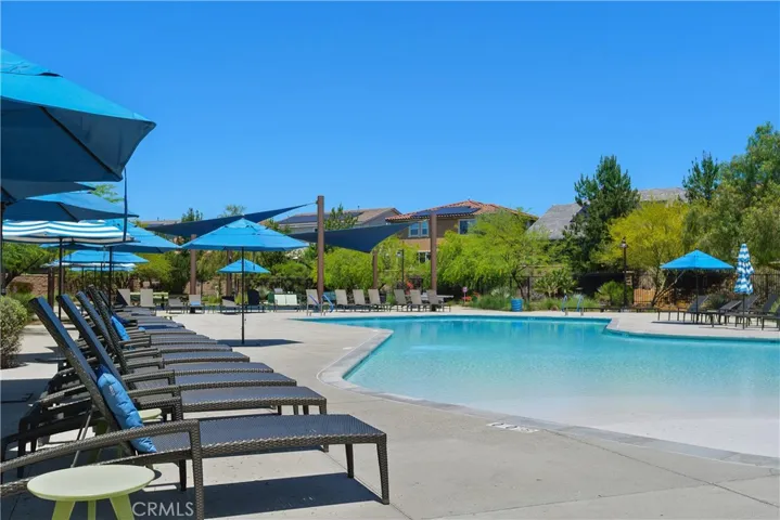 The Oasis is a premier 3-acre resort-style retreat featuring two sparkling pools, spacious sun decks, firepits, BBQ areas, shaded seating, and open lawn spaces for relaxing, gathering, and year-round enjoyment.