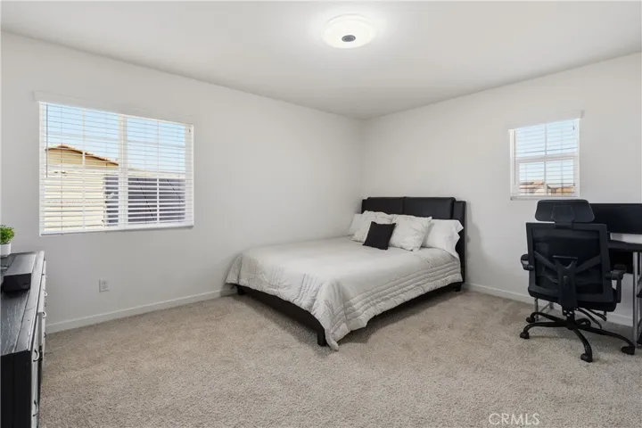 Secondary upstairs bedroom #1 with ample natural light