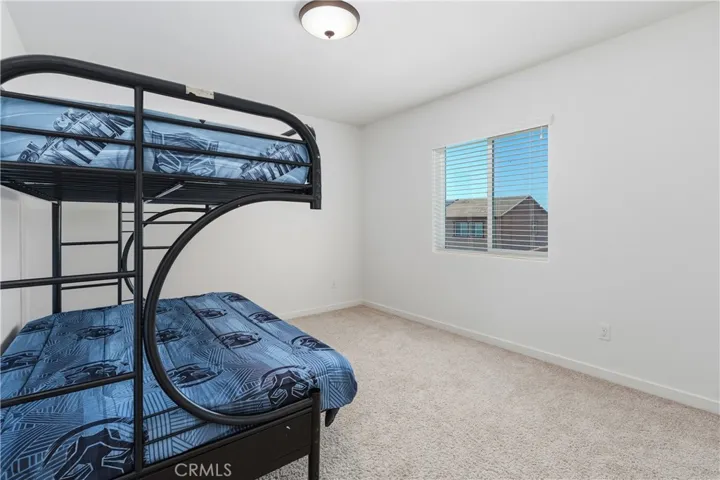 Secondary upstairs bedroom #2 with ample natural light