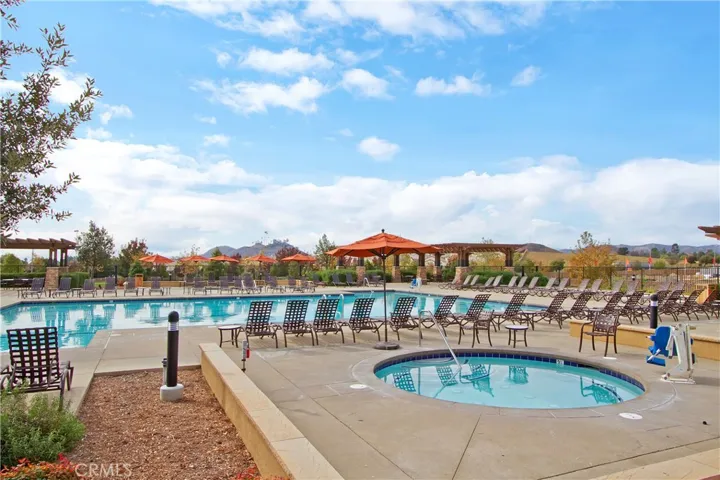At The Club at Spencer’s Crossing, the junior Olympic-size pool serves as a centerpiece for both fitness and leisure, offering ample space for lap swimming and recreational enjoyment. A dedicated children’s wading pool and two inviting jacuzzis complete the resort-style experience for all ages.