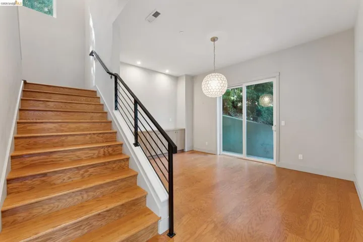 Hardwood stairs with modern black metal railing