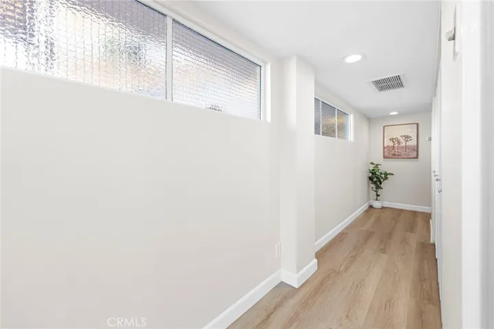 Hallway with additional storage.