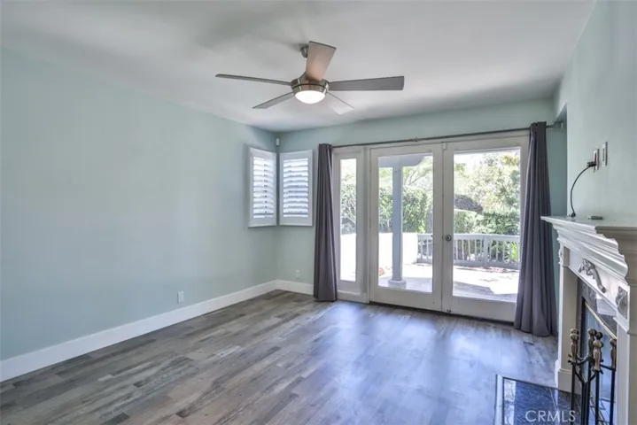 Spacious living room with fireplace and french doors to your large patio.