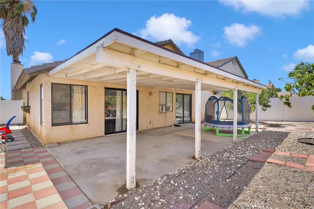 Large yard, vinyl fencing and covered patio