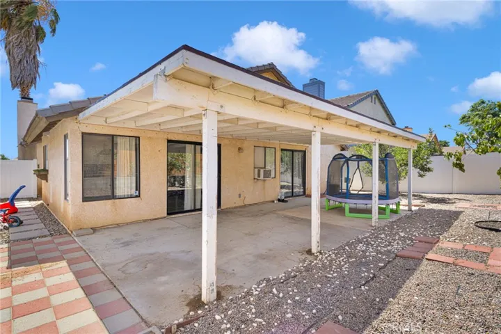 Large yard, vinyl fencing and covered patio