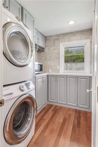Separate laundry room with storage off kitchen. Washer and Dryer included.