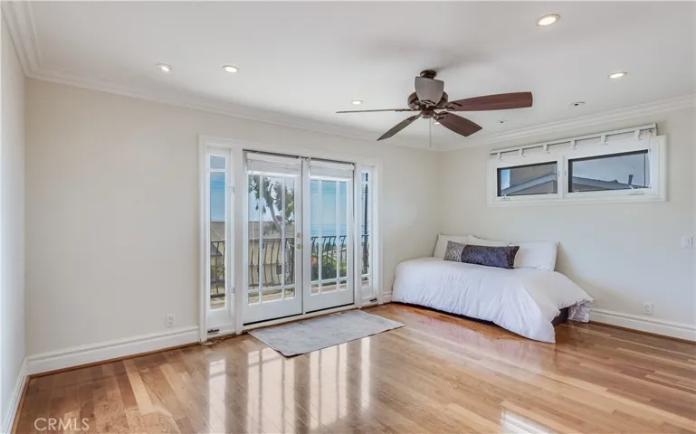 Primary bedroom with ocean view and walk in closet