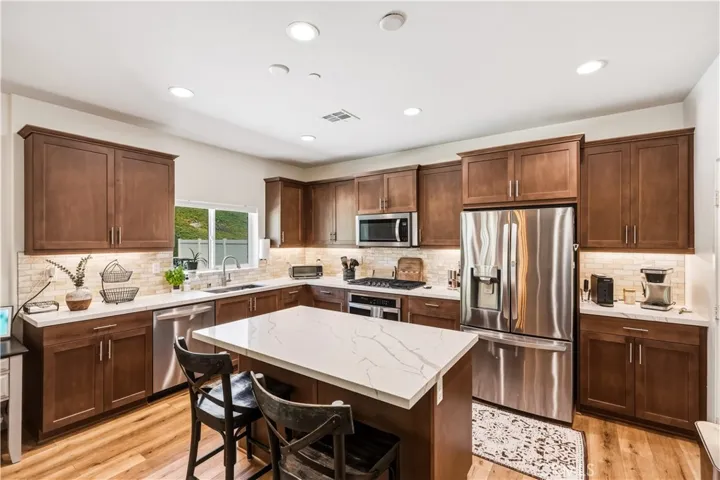 Island kitchen with quartz and stainless steel