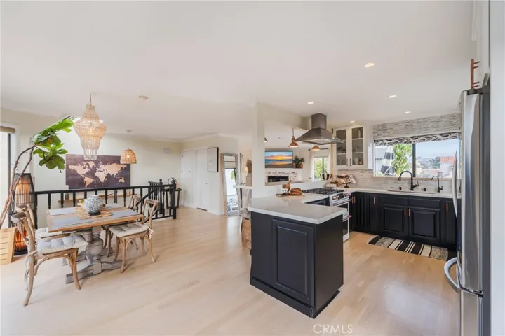 View towards the dumbwaiter door that brings groceries from the garage at the stairs past the dining area and kitchen.