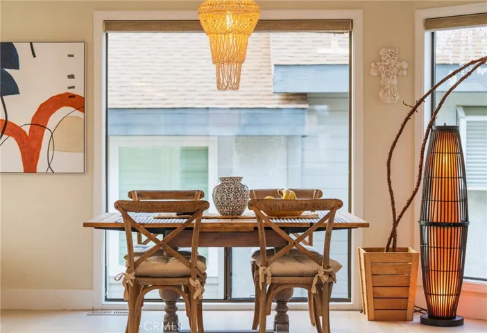 A comfortable dining area next to the kitchen with tremendous natural light