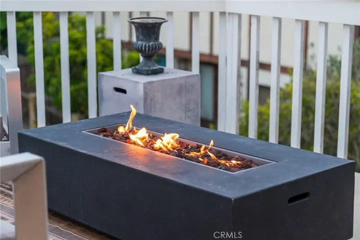 The deck from the kitchen has a gas fired feature