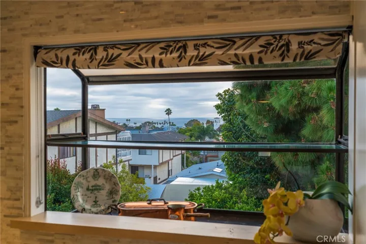 The kitchen bay window offers an expansive view and a place for memories