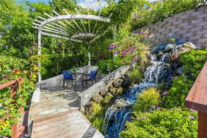 Sitting are under lighted pergola