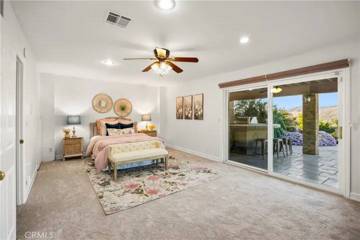 Downstairs Bedroom opens to patio with watrfall